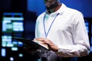 Proficient manager in professional data center providing vast computing resources and storage. Expert in server hub enabling artificial intelligence to process massive datasets for training photo