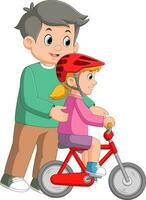 Caring dad teaching daughter to ride bike for the first time vector