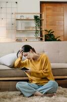 woman sit Depression Dark haired  pensive glance Standing by window and anxiety Copy space. at home photo