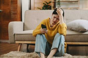 woman sit Depression Dark haired  pensive glance Standing by window and anxiety Copy space. at home photo