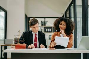 Business and Male lawyer or judge consult having team meeting with client, Law and Legal services concept.Customer service good cooperation in modern office photo
