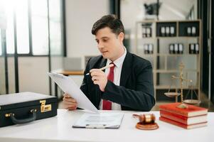 Mature man lawyer working and gavel, tablet, laptop in front, Advice justice and law concept. at office photo