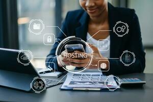 Web hosting concept, woman using computer, tablet and presses his finger on the virtual screen inscription Hosting Internet, business, digital technology concept. photo