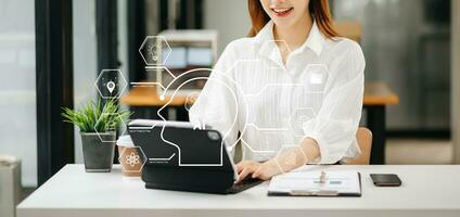 Business woman using chatbot in computer and tablet  smart intelligence Ai.Chat with AI Artificial Intelligence, developed by OpenAI generate. Futuristic technology, robot in online system. photo