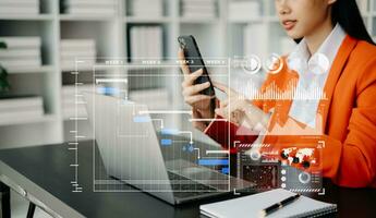 Businesswoman hand Project manager working and update tasks and Gantt chart scheduling virtual diagram.with smart phone, tablet and laptop photo