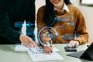 Two woman using chatbot in computer and tablet  smart intelligence Ai.Chat with AI Artificial Intelligence, developed by OpenAI generate. Futuristic technology, robot in online system. photo