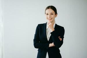 Smiling caucasian young businesswoman bank employee worker manager boss ceo looking at camera, using tablet, laptop and notepad online isolated in white background photo