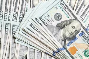 Background with money american hundred dollar bills, horizontal. Top view of business concept on background with copy space photo