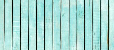 blue old wooden fence. wood palisade texture. planks background photo