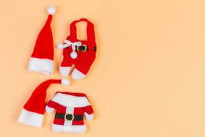 Top view Banner of colorful holiday background made of Santa hats and clothes. Merry Christmas concept with copy space photo