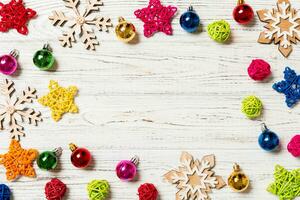 Top view of Christmas decorations and toys on wooden background. Copy space. Empty place for your design. New Year concept photo