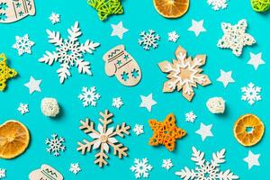 Top view of blue background with New Year toys and decorations. Christmas time concept photo