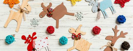 Top view Banner of Christmas toys on wooden background. New Year ornament. Holiday concept photo