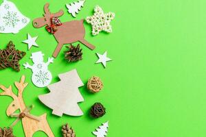 Christmas green background with holiday toys and decorations. Happy New Year concept with empty space for your design photo