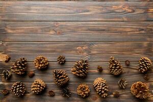 Christmas pine cones on colored paper border composition. Christmas, New Year, winter concept. Flat lay, top view, copy space photo