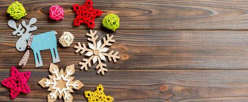 Top view Banner of Christmas decorations and toys on wooden background. Copy space. Empty place for your design. New Year concept photo