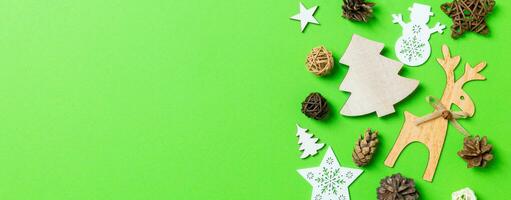 Banner Christmas green background with holiday toys and decorations. Happy New Year concept with empty space for your design photo