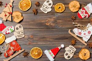 Top view of Christmas decorations and toys on wooden background. Copy space. Empty place for your design. New Year concept photo