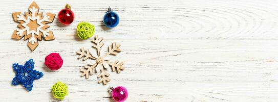 Top view of Christmas decorations and toys on wooden background. Copy space. Empty place for your design. Banner New Year concept photo