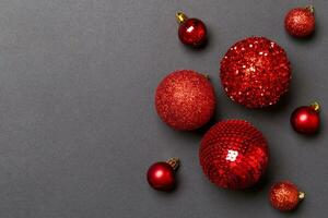 Top view of Christmas balls and creative decorations on colorful background with copy space. New Year concept photo