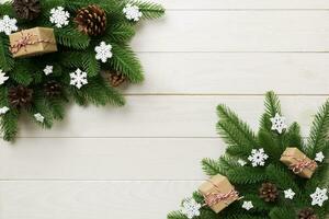 Christmas decorations and fir tree branch and gift boxon dark table. Top view frame with copy space photo