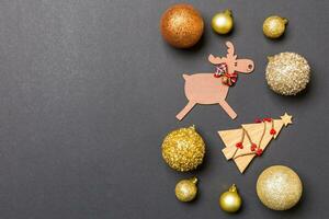 New Year composition made of baubles, reindeer and other decorations on colorful background. Christmas time concept with empty space for your design photo