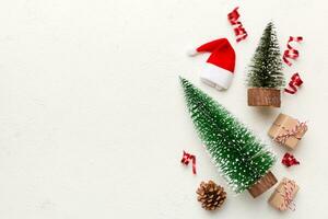 Flat lay composition with christmas trees on color background. Top view with copy space photo