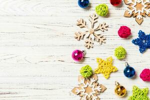 Top view of Christmas decorations and toys on wooden background. Copy space. Empty place for your design. New Year concept photo