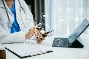 Medicine doctor using digital tablet and smartphone diagnose virtual electronic medical record on interface.Digital healthcare and network on virtual screen technology photo