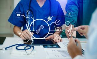 Medical technology network team meeting concept. Doctor hand working with smart phone modern digital tablet and laptop computer with graphics chart interface, with virtual icon photo