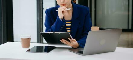 Working Process in Modern Office. Young Woman Account Manager Working at Table with New Business Project. Typing keyboard Laptop. Horizontal. photo