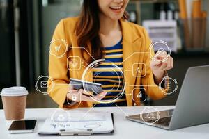 Woman accountant use Laptop and calculator to calculate the company's financial with icon banking on data network of finance and banking with business growth photo