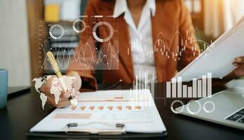 Businessman hand Project manager working and update tasks and Gantt chart scheduling virtual diagram.with smart phone, tablet and laptop photo