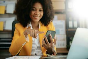 African businesswoman hand working with new modern computer using on smartphone and tablet as concept photo