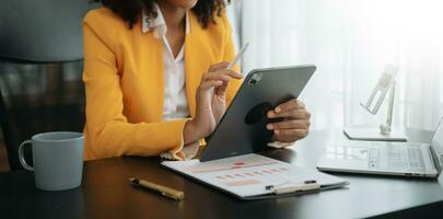 African businesswoman hand working with new modern computer using on smartphone and tablet as concept photo