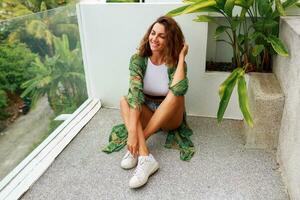 Woman in stylish dress posing outdoor photo