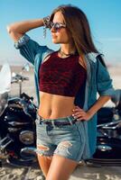 Young amazing sexy woman  wearing stylish crop top , shirts, have perfect fit slim tamed body and long hairs. Outdoor lifestyle   portrait. photo