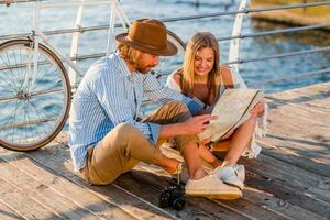 attractive happy smiling couple traveling in summer by sea photo