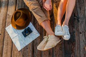 attractive happy smiling couple traveling in summer by sea photo