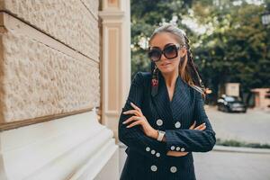 stylish attractive woman street fashion in suit photo