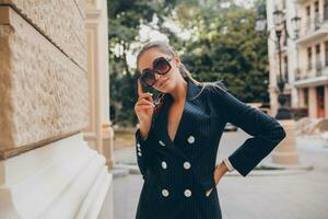 stylish attractive woman street fashion in suit photo