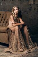 beautiful woman in evening dress sitting in chair, luxury glamour style photo