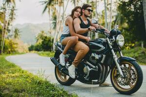 young couple in love, riding a motorcycle, hug, passion, free spirit photo