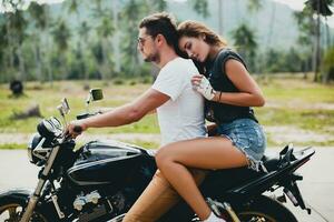 young couple in love, riding a motorcycle, hug, passion, free spirit photo