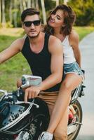 young couple in love, riding a motorcycle, hug, passion, free spirit photo