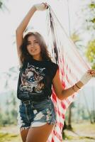 young sexy woman, passion, free spirit, vintage, hipster, holding american flag photo