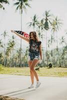 young sexy woman, passion, free spirit, vintage, hipster, holding american flag photo