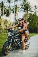 young couple in love, riding a motorcycle, hug, passion, free spirit photo