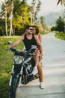 young couple in love, riding a motorcycle, hug, passion, free spirit photo