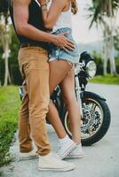 young couple in love, riding a motorcycle, hug, passion, free spirit photo